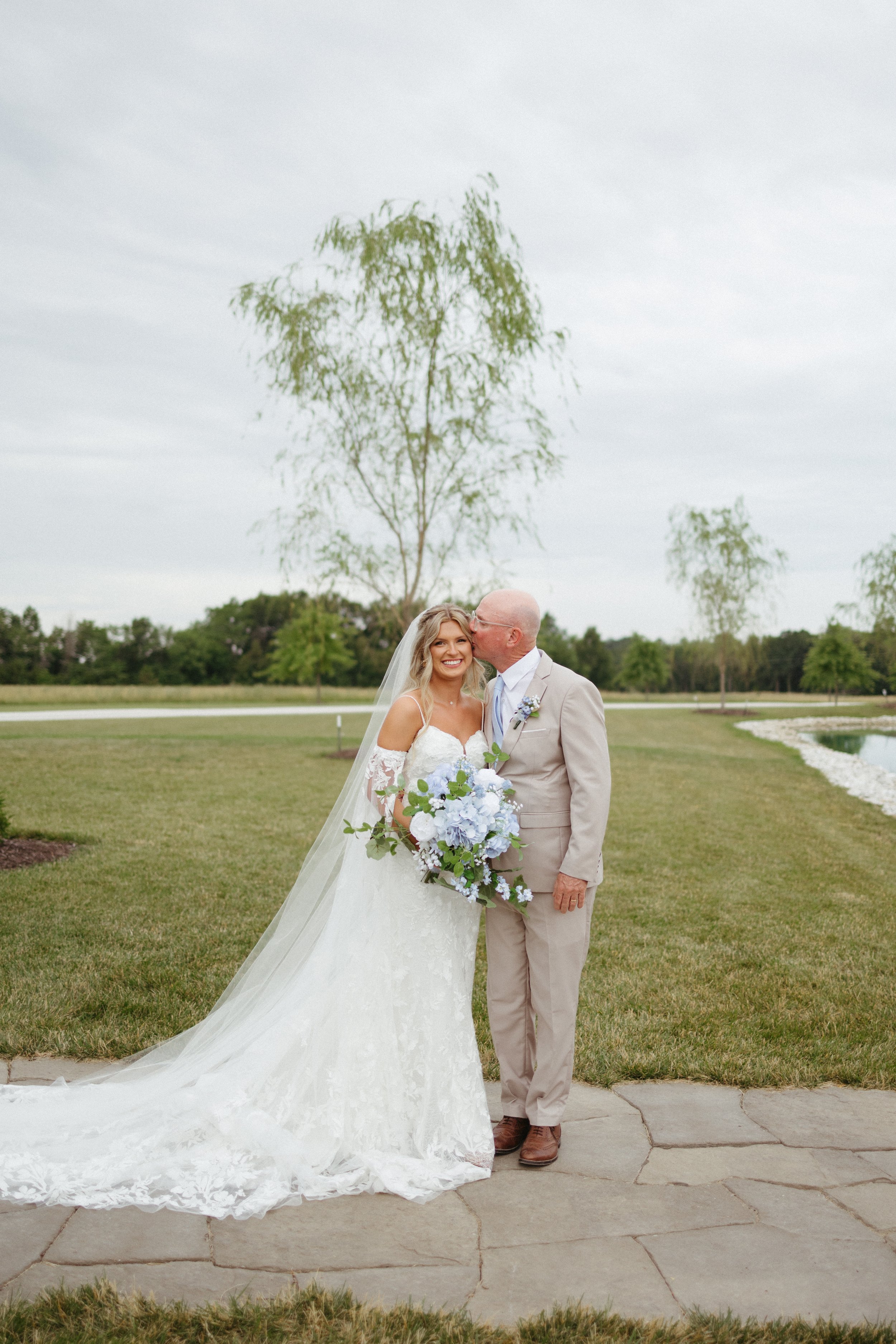 father daughter first look wedding day outside lake emerson fields venue missouri (1).jpg