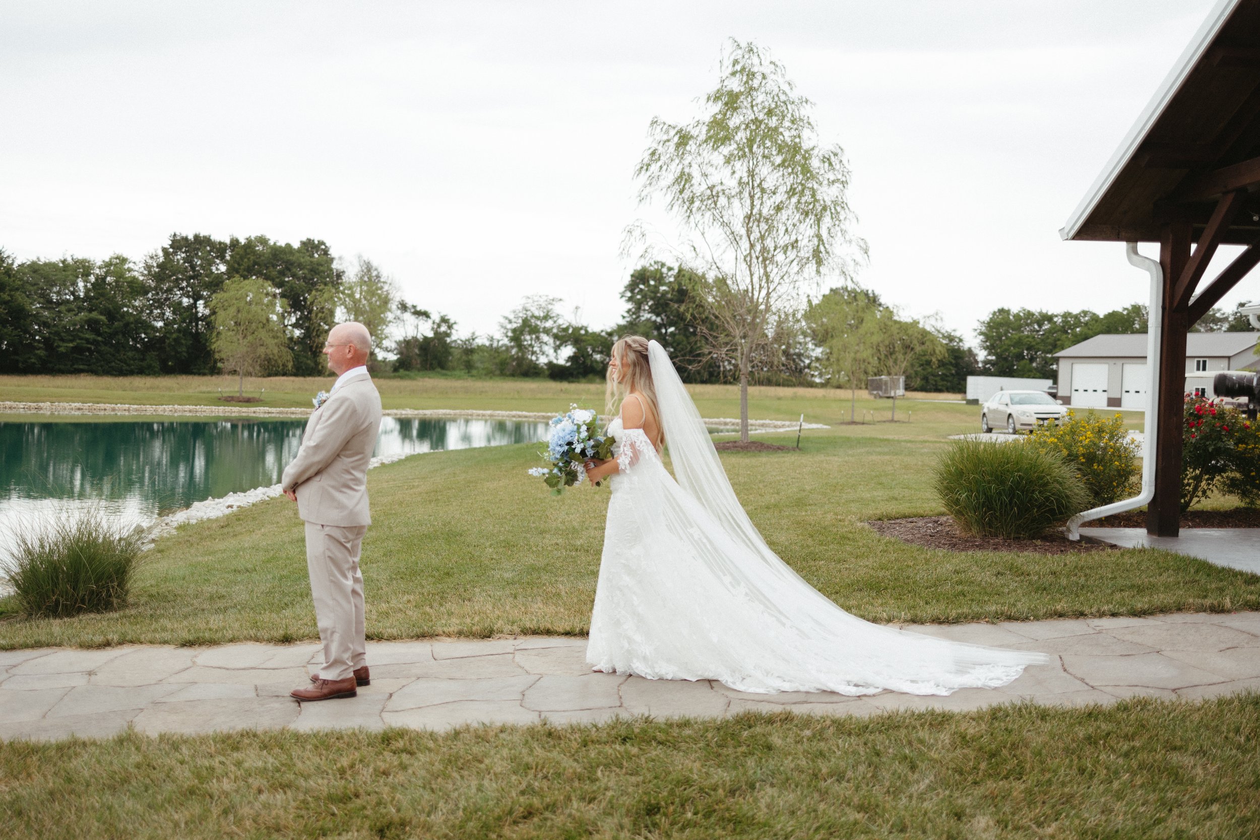 father daughter first look wedding day outside lake emerson fields venue missouri (3).jpg