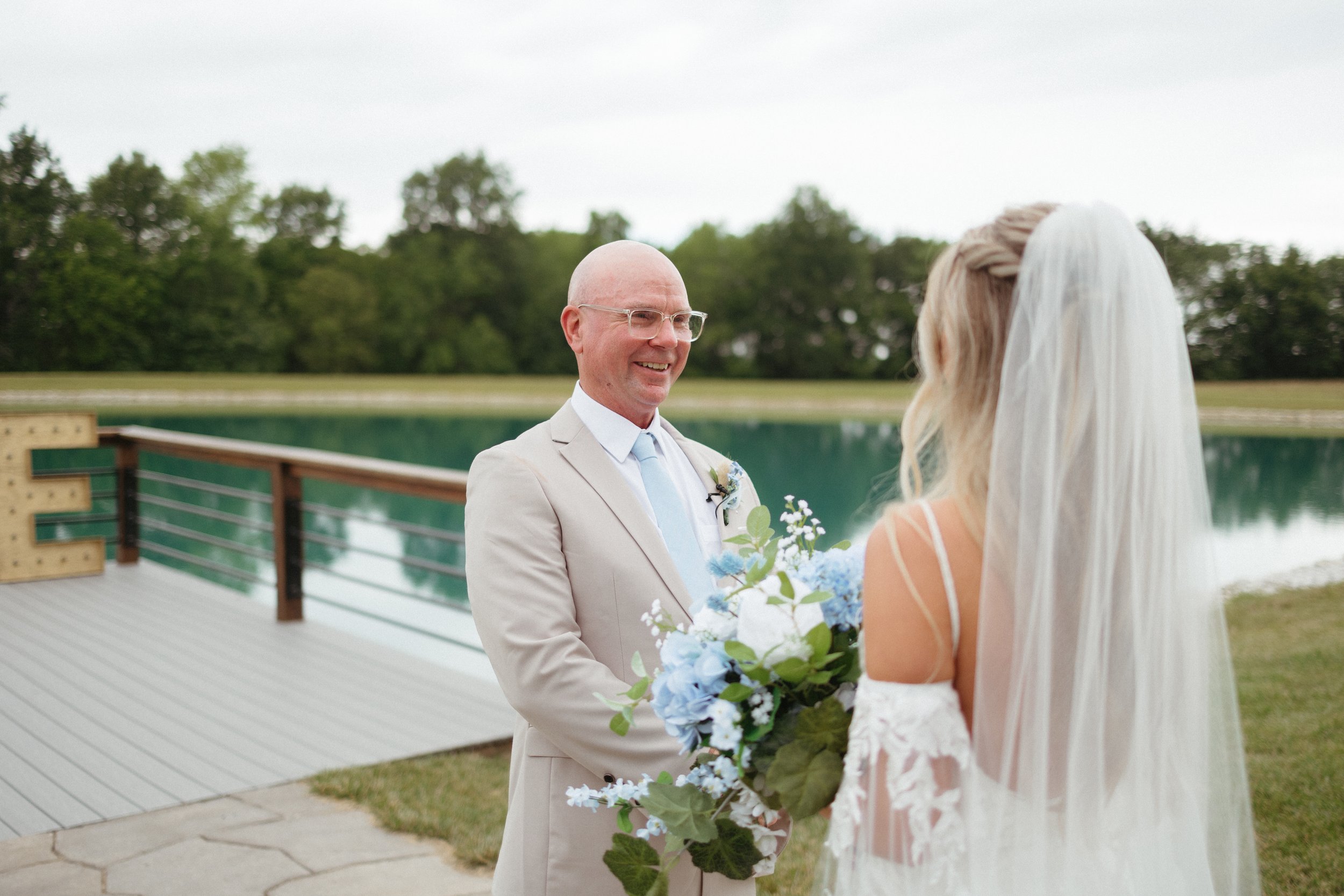 father daughter first look wedding day outside lake emerson fields venue missouri 7.jpg