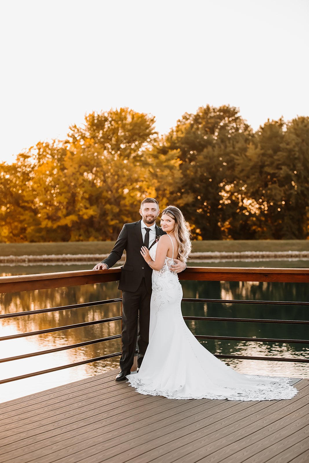 outdoor fall wedding portraits bride groom lake dock emerson fields.jpg