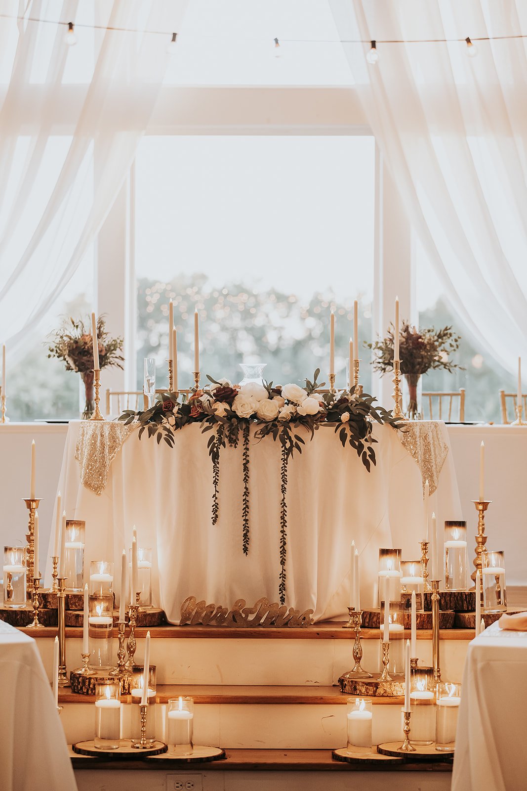 fall head table design gold candles glowing indoor.jpg