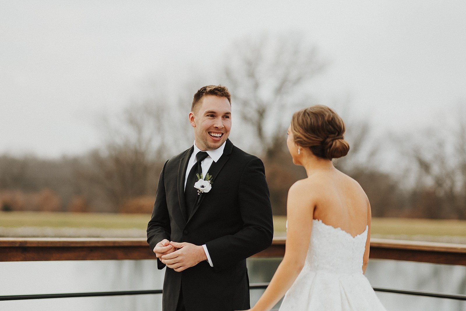 first look bride and groom_winter wedding_lakeside_missouri_emerson fields (2).jpg