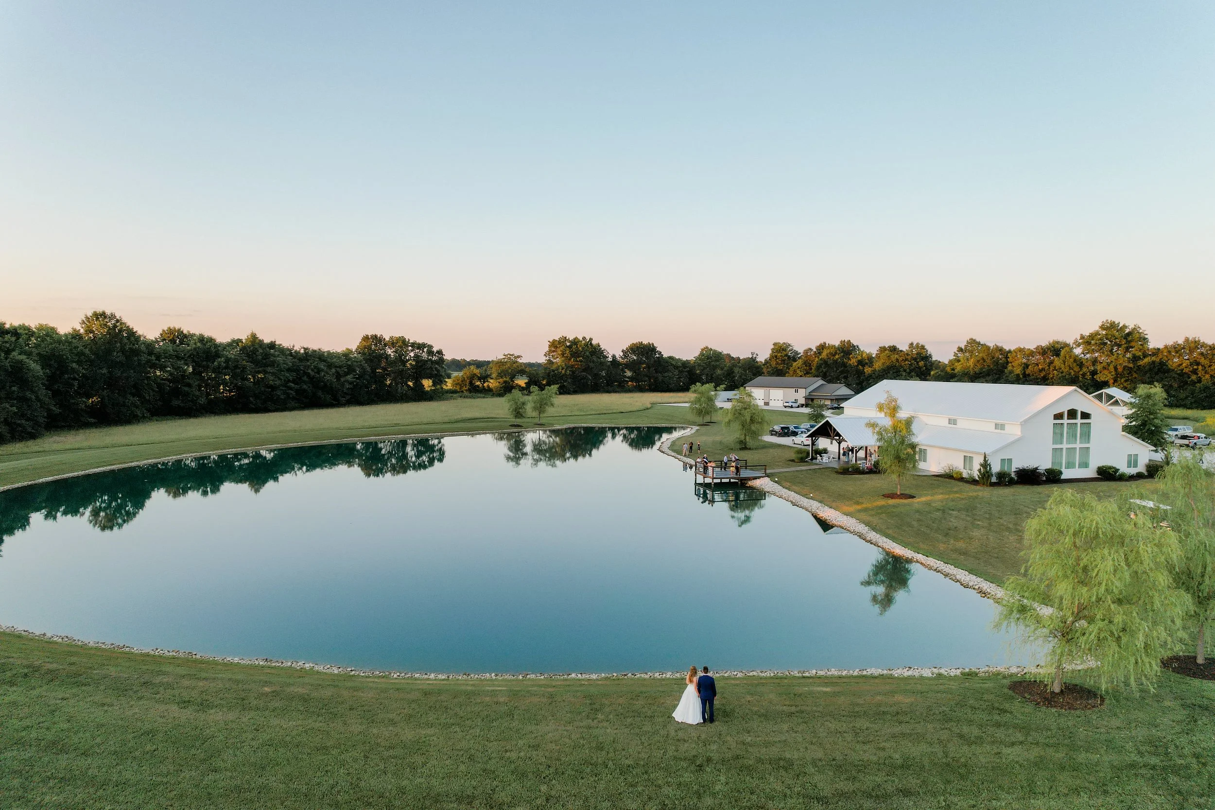 Emerson Fields wedding venue and estate in central Missouri with a lakeside cocktail hour and photographed by Bella Faith Photography from Columbia Missouri