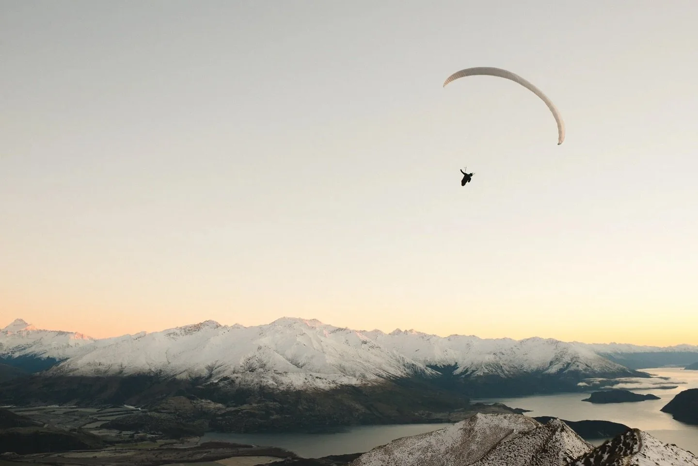 I left at 5am to summit Roy&rsquo;s Peak, Wanaka, by sunrise. Just before the top a paraglider launched and floated 10m above me.  We both smiled and said good morning then went our separate ways.  I was instantly anxious to catch this shot as I saw 