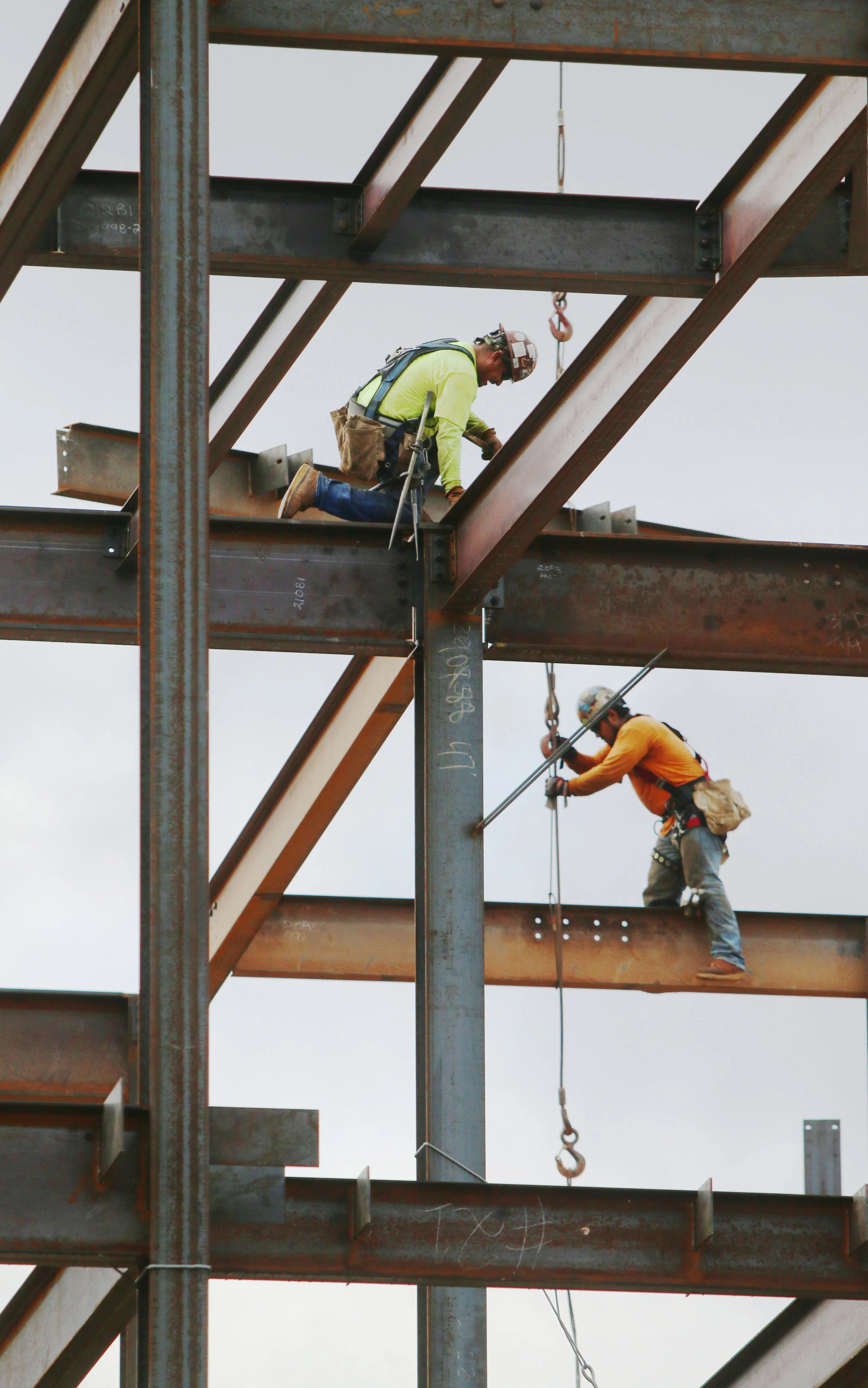  Joel Resto and Jose Murillo, iron workers with Dixie Erectors, work on steel beams at the rising Brookhaven Medical Center II in Brookhaven, Georgia.  