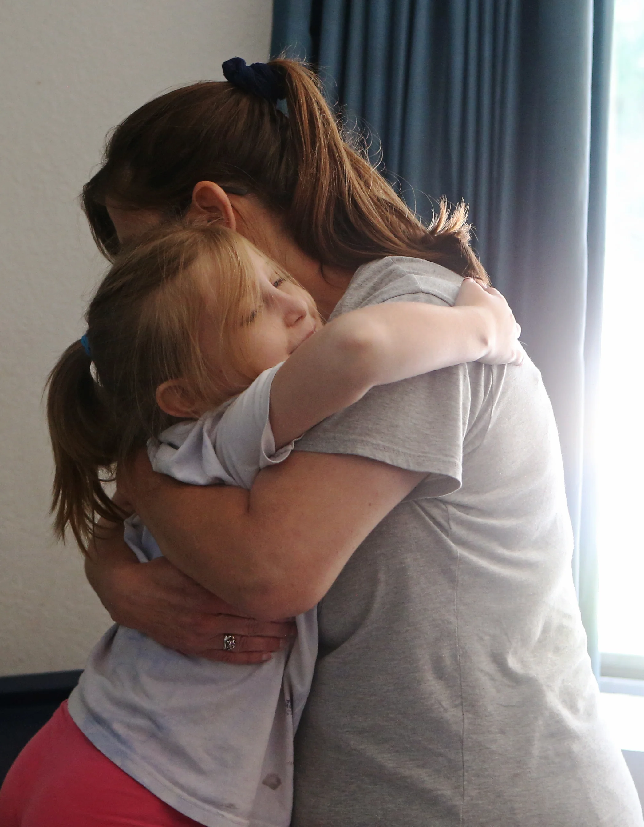  Rimbey and Sarah Schroeder embrace. 