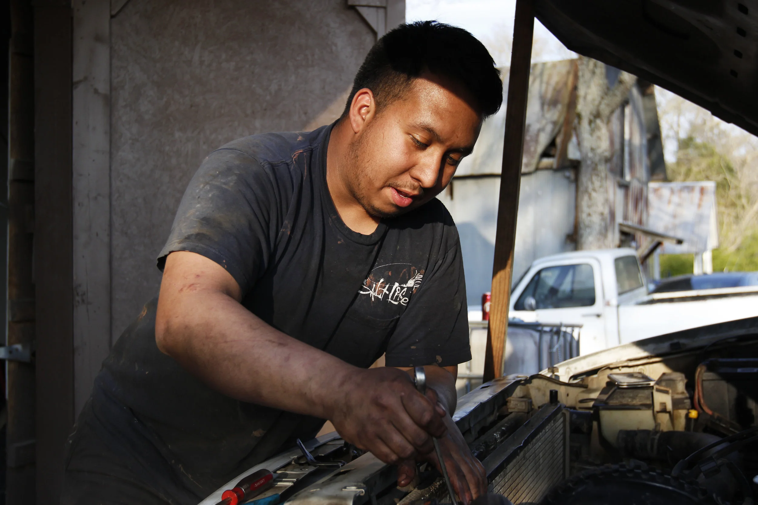  Andre Aparicio works on a truck at Aparicio’s Garage in Greensboro, Georgia.  