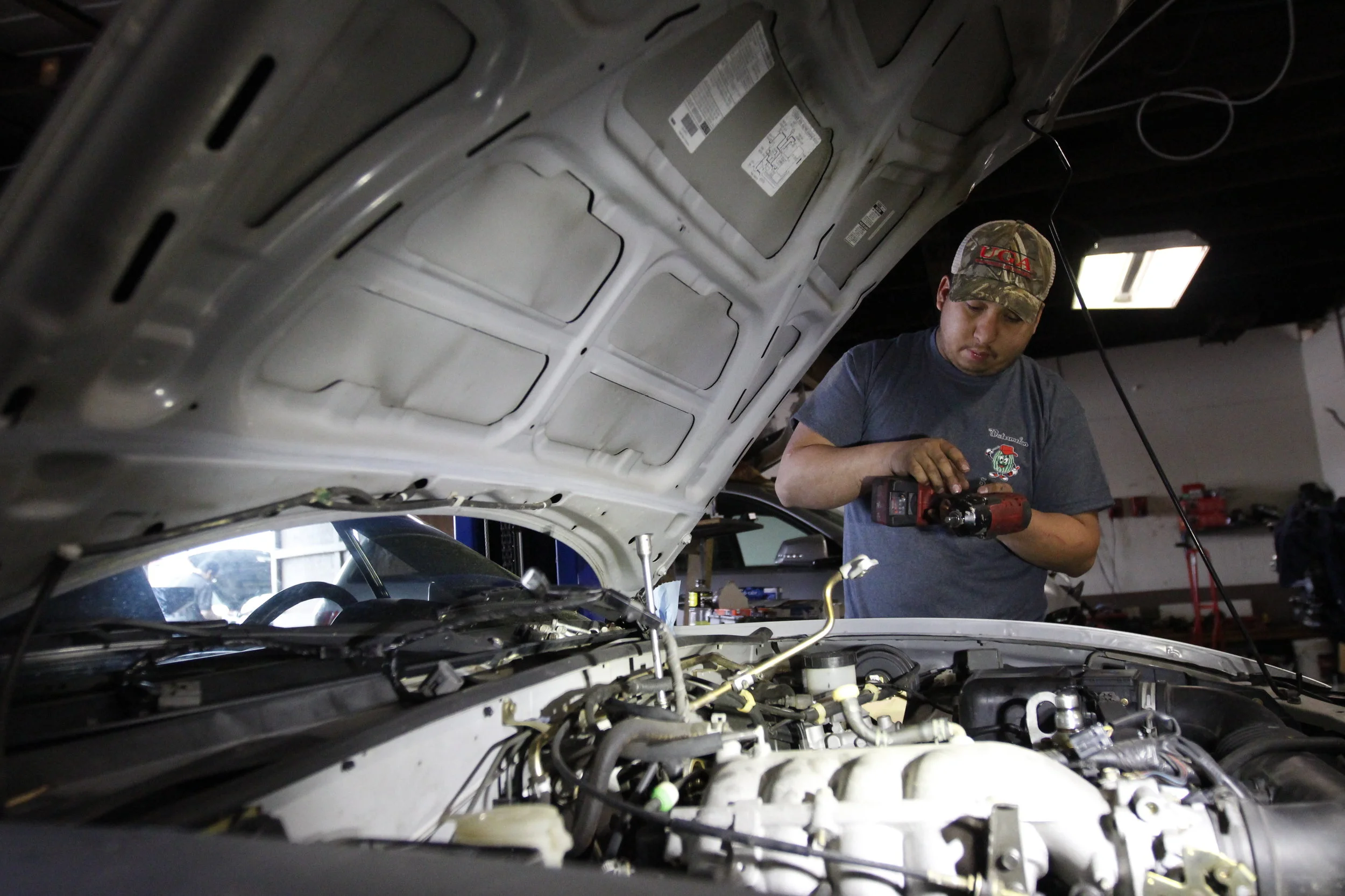  Andre Aparicio works on a vehicle in Aparicio’s Garage in Greensboro, Georgia.  