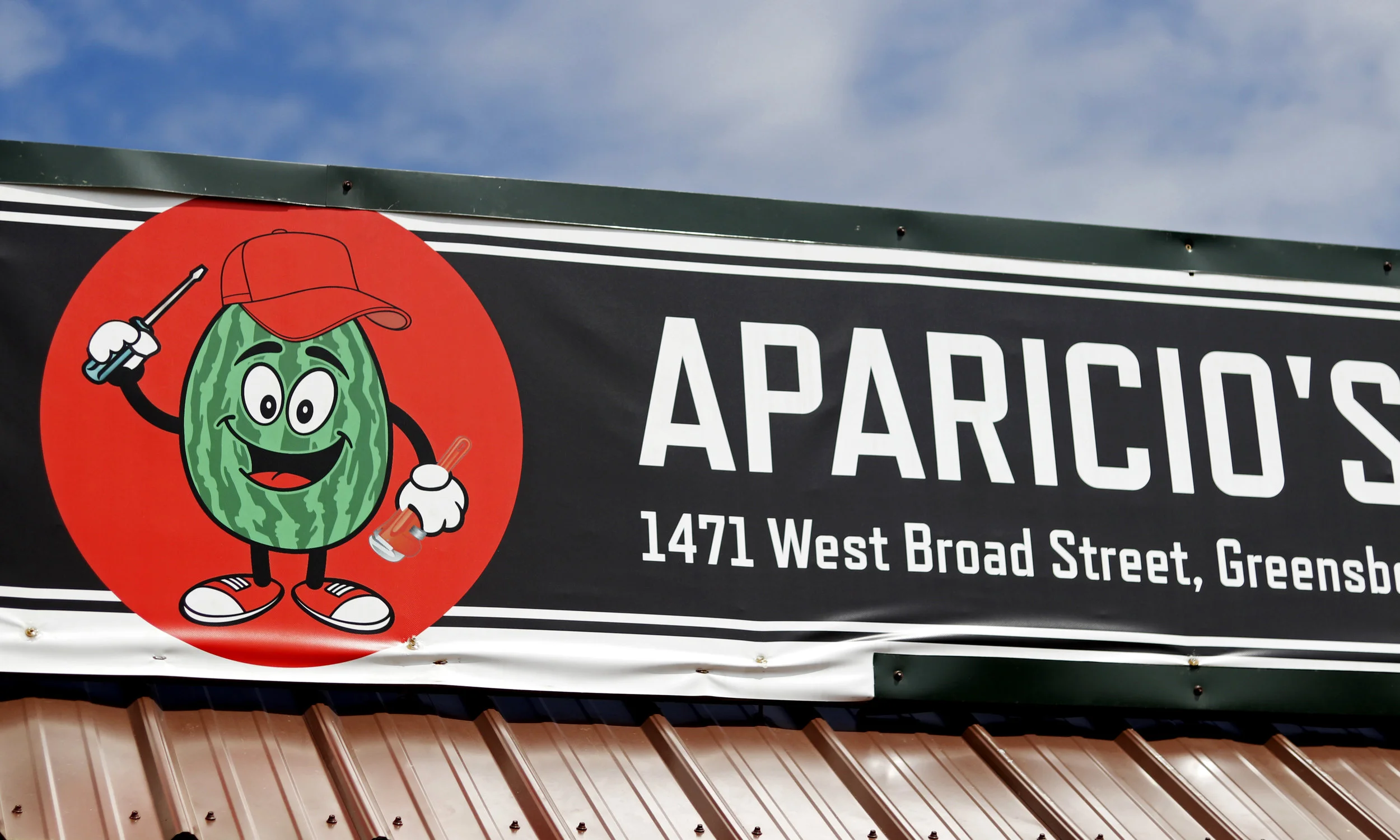  A photo of the logo for Aparicio’s Garage. According to Andre, the watermelon was inspired by his father Javier’s nickname, Sandilla, (watermelon in Spanish) given to him because of his round figure. 