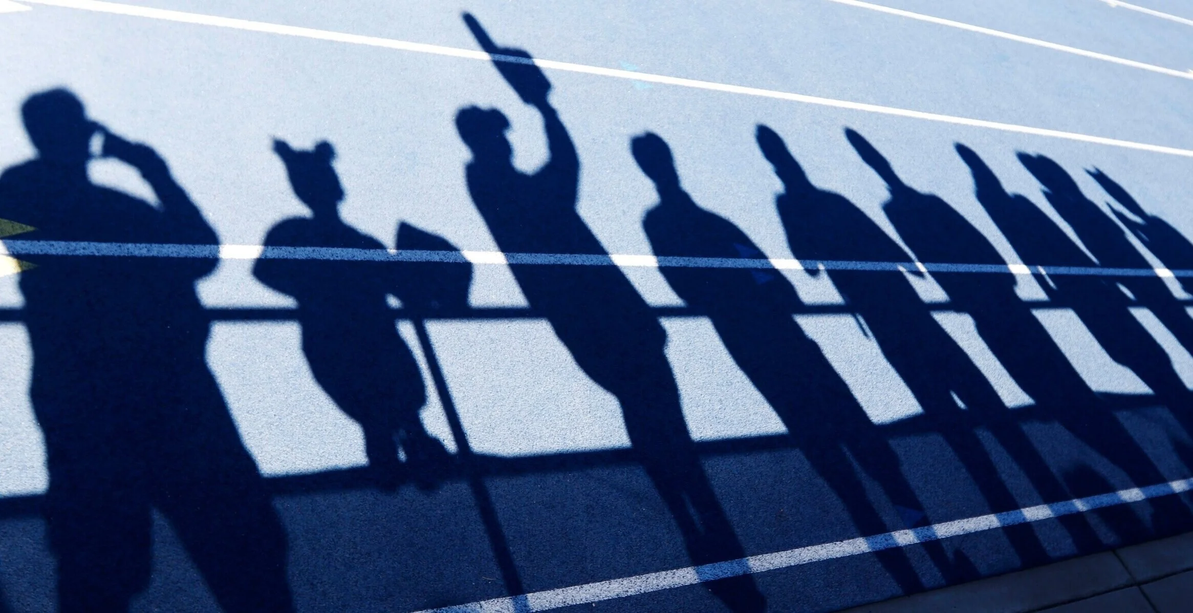  Crystal Boyd (third shadow from left), 19, of Graham, Washington, wears a foam finger and cheers with other Team Air Force fans during the Department of Defense Warrior Games, on Saturday, June 2, 2018, at the U.S. Air Force Academy in Colorado Spri
