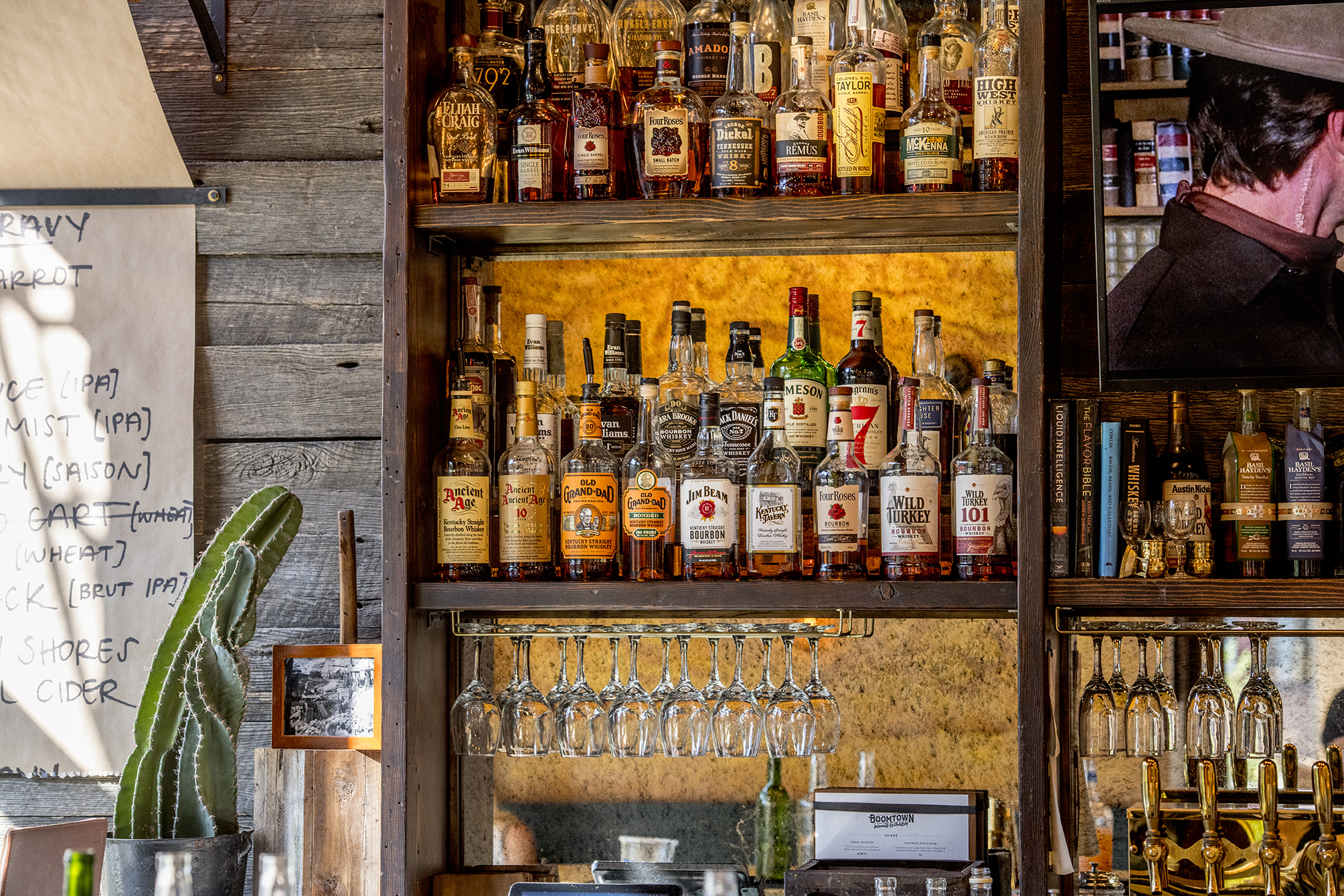  Large array of whiskey options inside the bar at  Boomtown Biscuits &amp; Whiskey . || Image:  Twin Spire Photography  - Published: 10.9.2019 