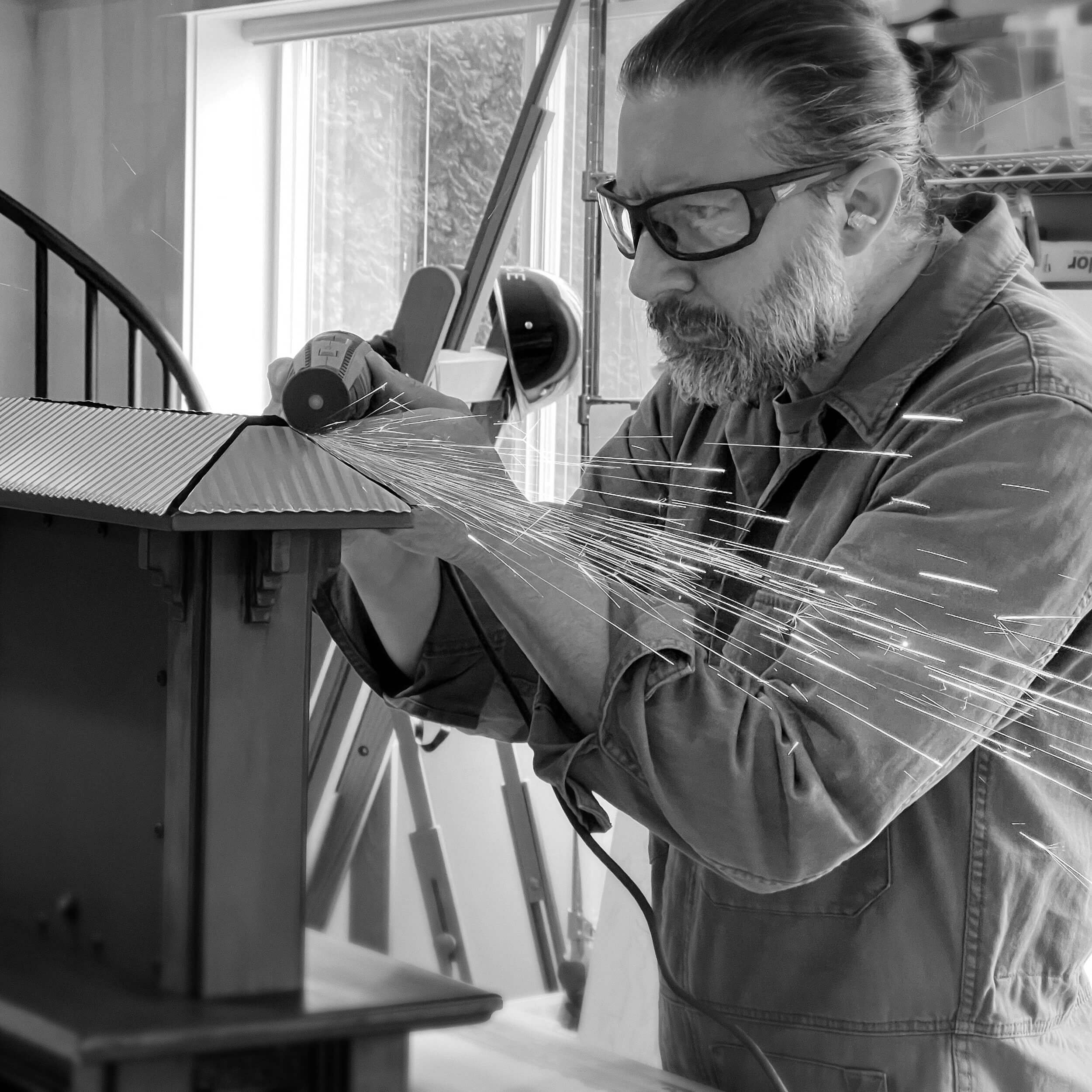 Royce Owen working on an original artwork in the studio