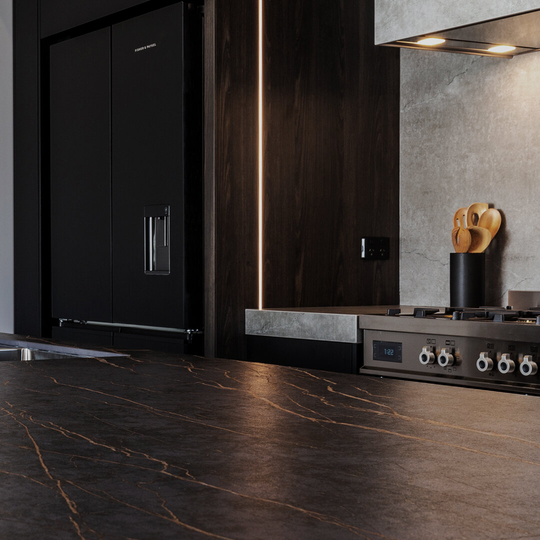 A glimpse of our latest masterpiece! Designed and manufactured by our talented team. We're so proud of this recently completed kitchen features stunning porcelain benchtops with a textured, veined surface that's both elegant and functional. LED strip