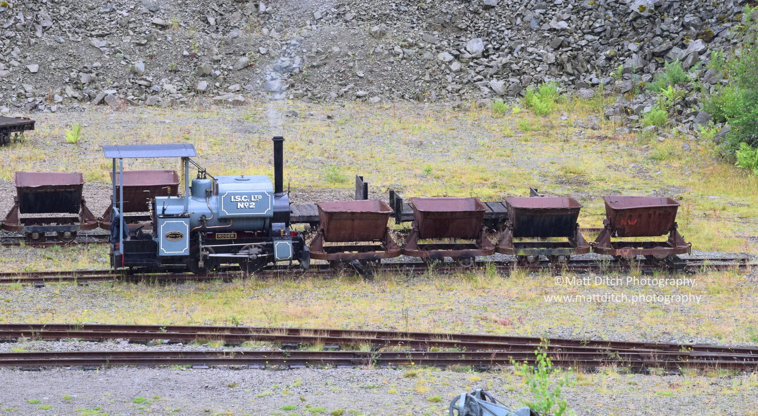  “Roger” and a short goods train viewed from the upper quarry level. 