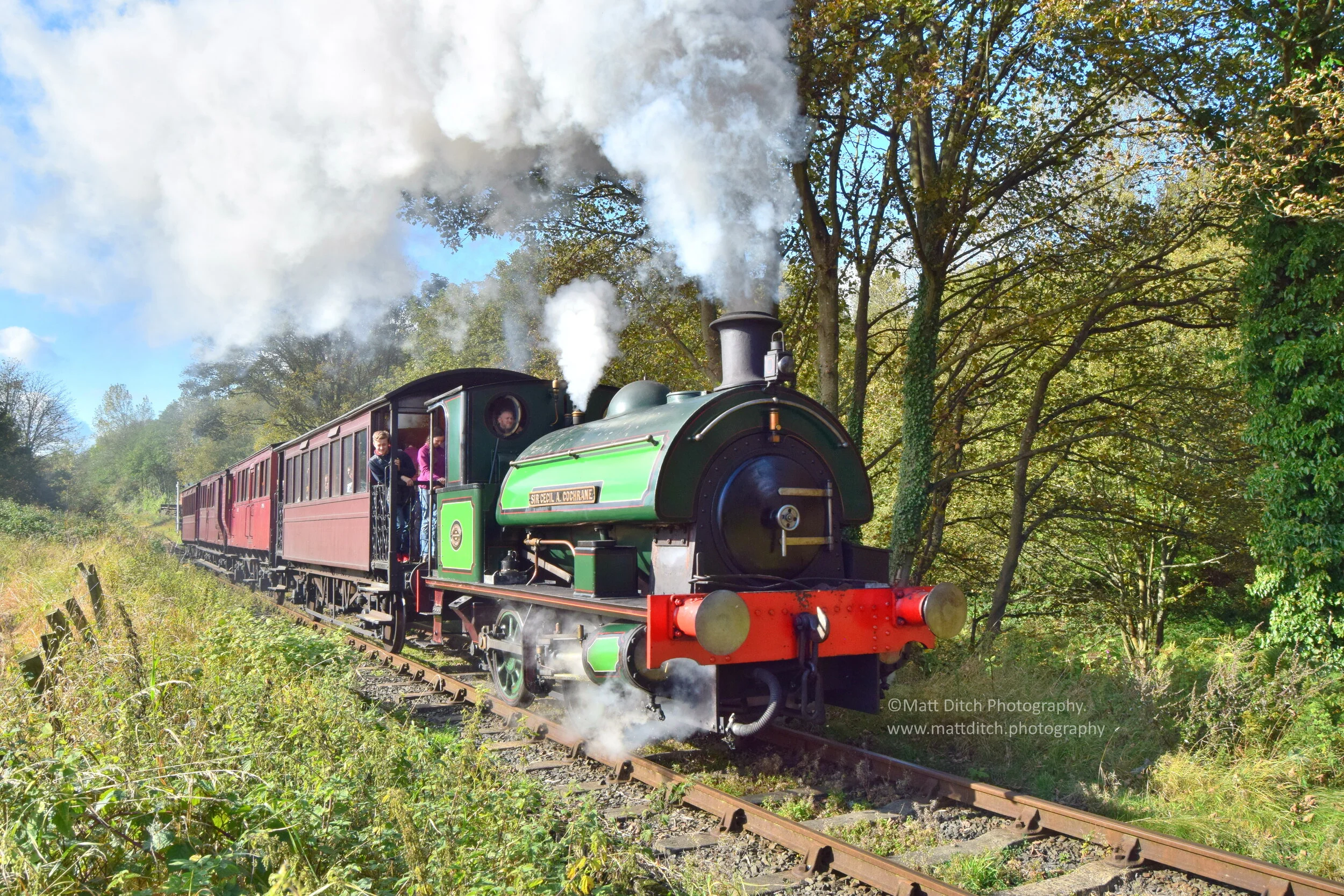  0-4-0ST “Sir Cecil A Cochrane” puts on a fine display as it powers away from East Tanfield. 