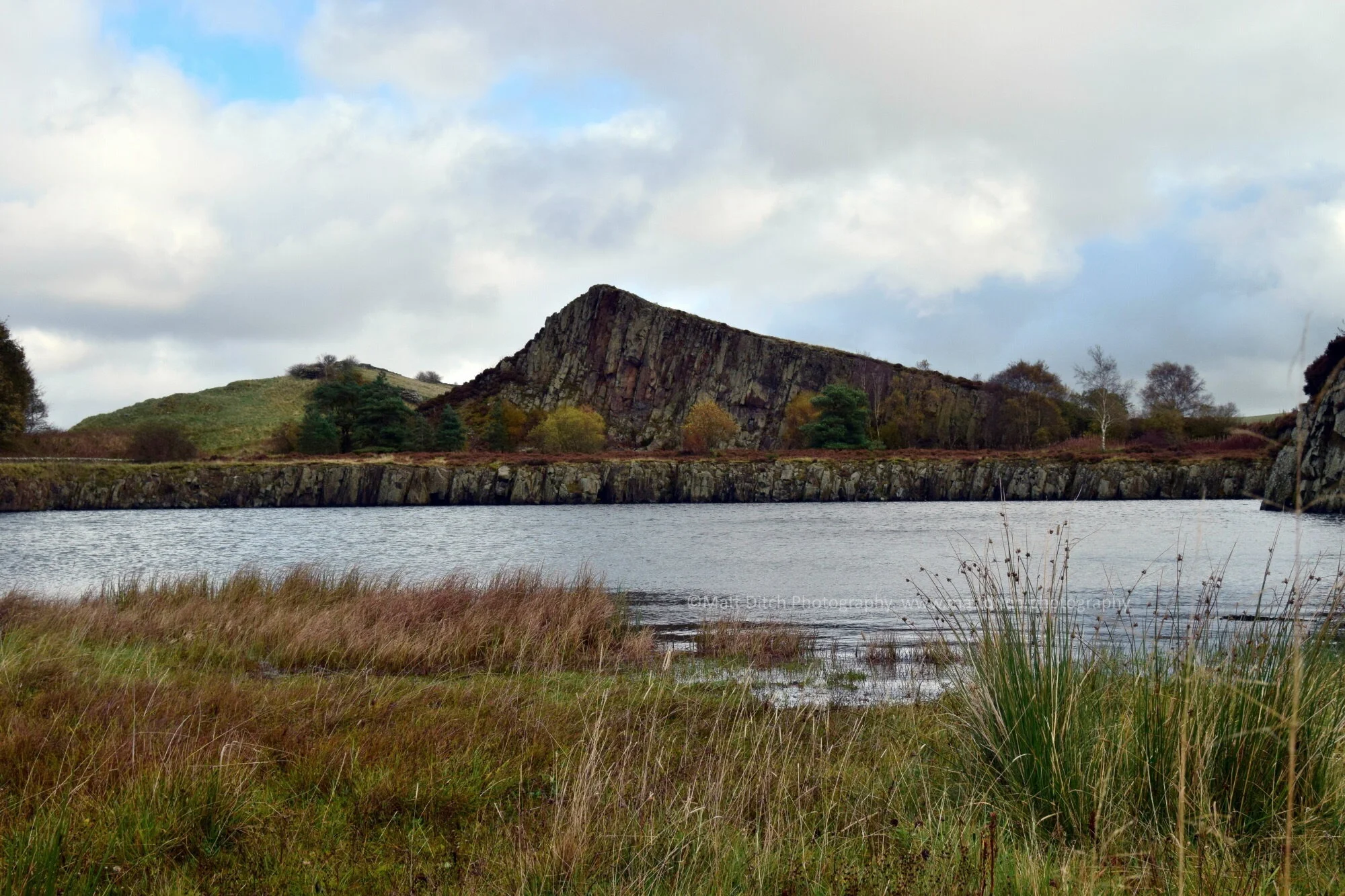  From here the railway continues running along the side of the Burn. It skirts the edge of a Roman camp, the remains can be seen on Google Earth near the Milecastle Inn. The railway also crosses the route of the course of the "Vallum" and Hadrian's W