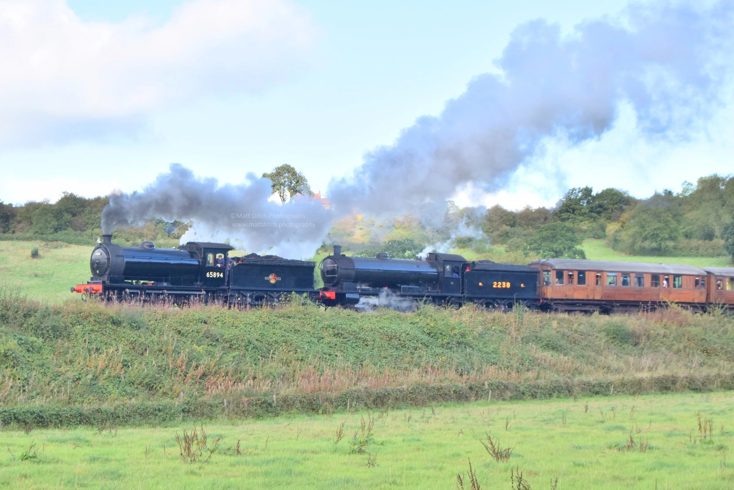  J27 No.65894 &amp; T2 (Q6) No.2238 double head a train away from Grosmont. 
