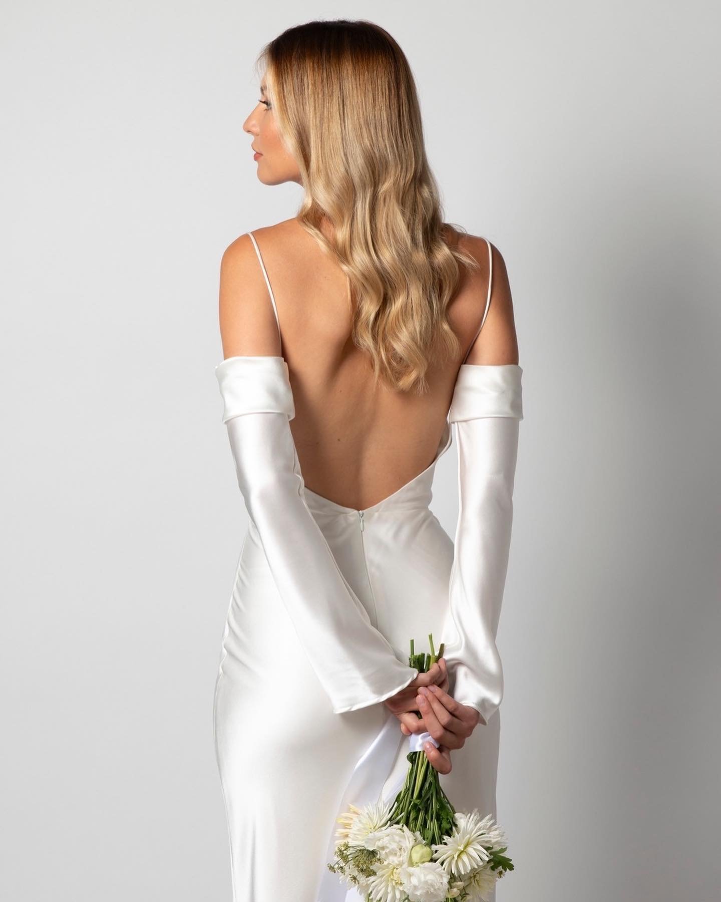 If you have been following us for awhile you may have noticed we are big on using accessories to personalise and elevate your bridal look. We&rsquo;ve just added the SUMMER SLEEVES to our collection. Bias cut silk satin these slip on and off so you c