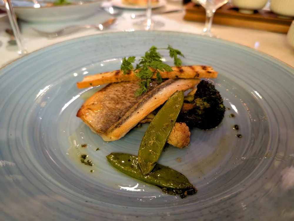 A dinner plate with sea bream and roasted veggies from Al Fresco on the AmaMagna
