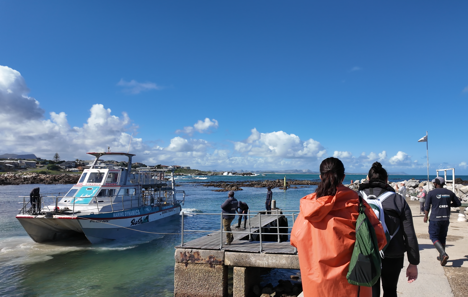The ladies walk towards the Marine Dynamics boat docked