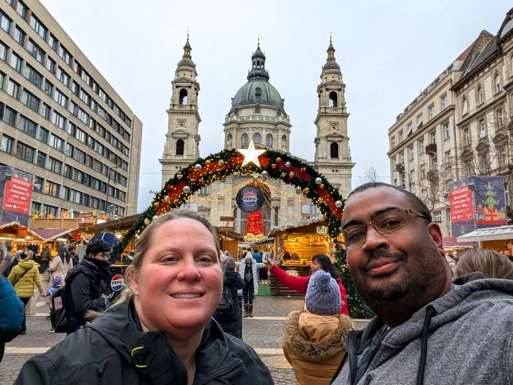 Tim and Anne pose for a selfie at the entrance of the St. Stephen’s Basilica Market in Budapest, Hungary