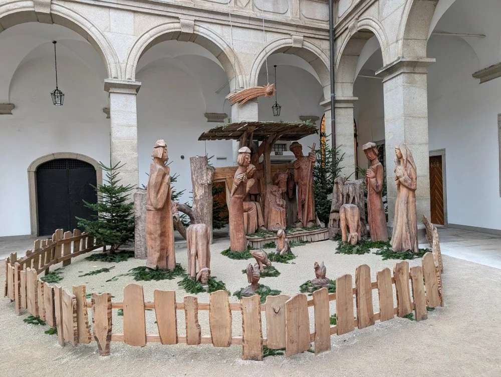 A stylized wood carved Nativity scene in Lintz