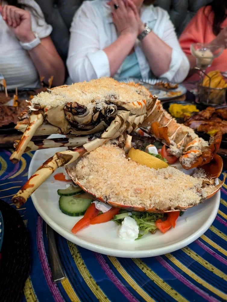 Two halves of the Cabo Delgado lobster on a dining plate at Mama Africa
