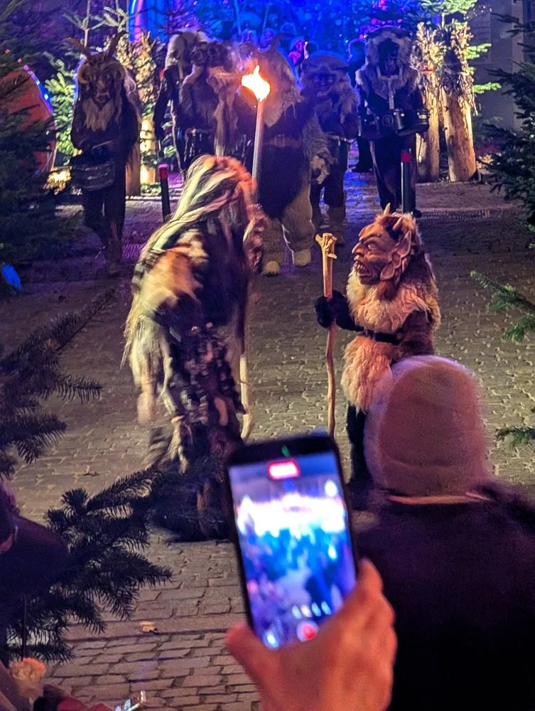a pair of Krampus performers at the Vilshofen Christmas Market