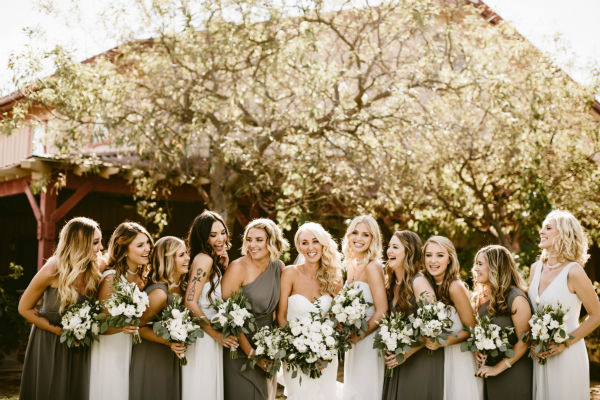 Bride in the center of 10 bridesmaids