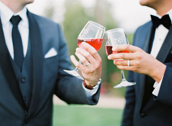 Two men toasting to celebrate marriage