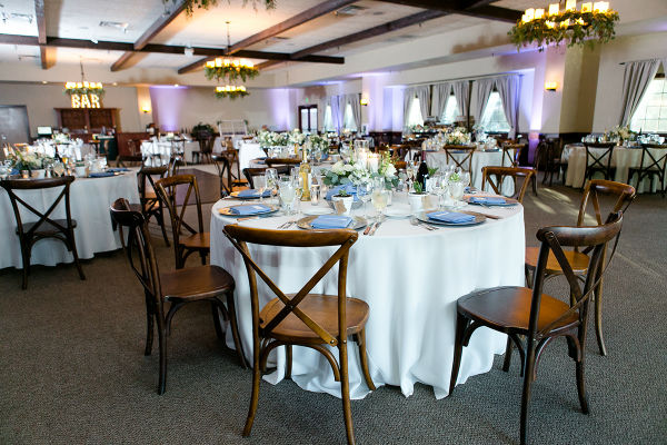 Reception tables set with white linens