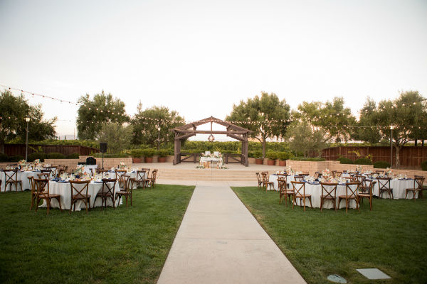 Tables on the grass &amp; head table on the stage of Mountain View venue