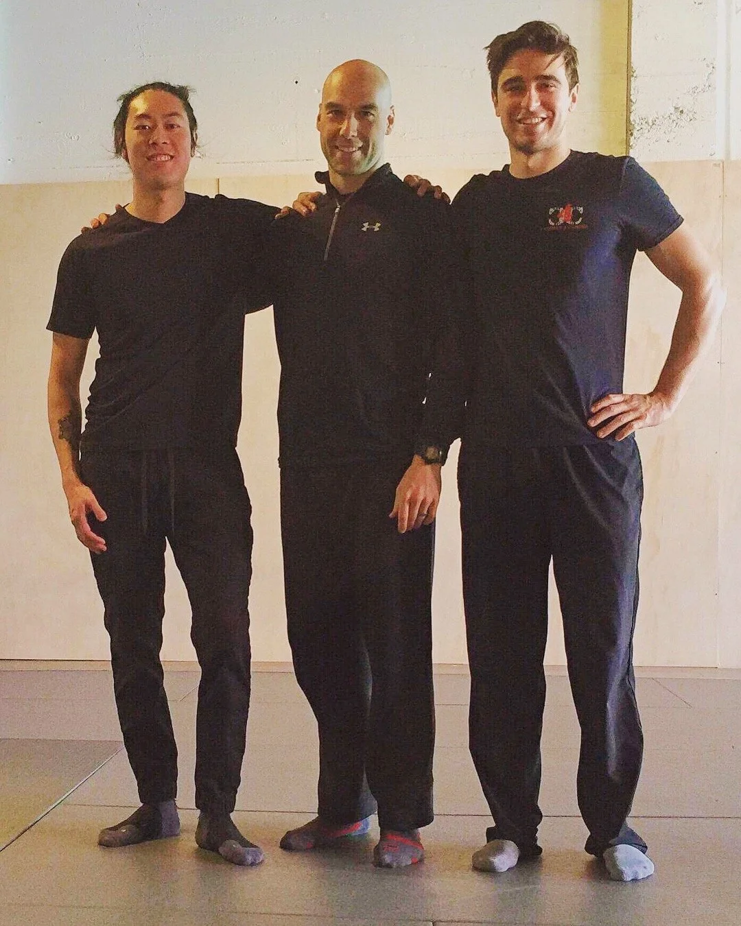 John Fawcus with two clients at a workshop.