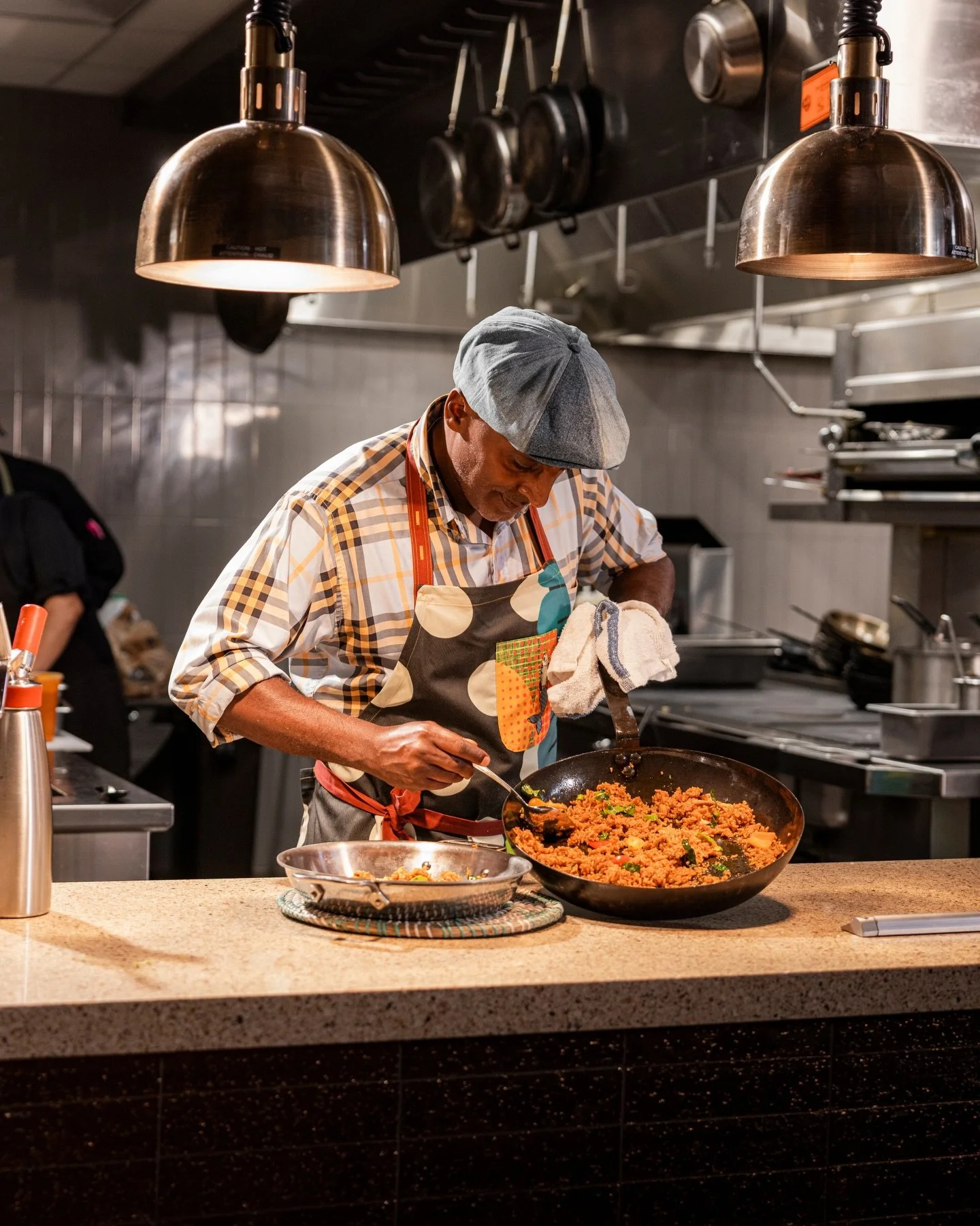 In the kitchen at @DineMarcusDC cooking up two of our biggest favorites: Mel&rsquo;s Crab Rice and Chuck B&rsquo;s Roasted Bird. These dishes are bold, generous, and made for sharing and celebrating! Click the link in bio to book your reservation.