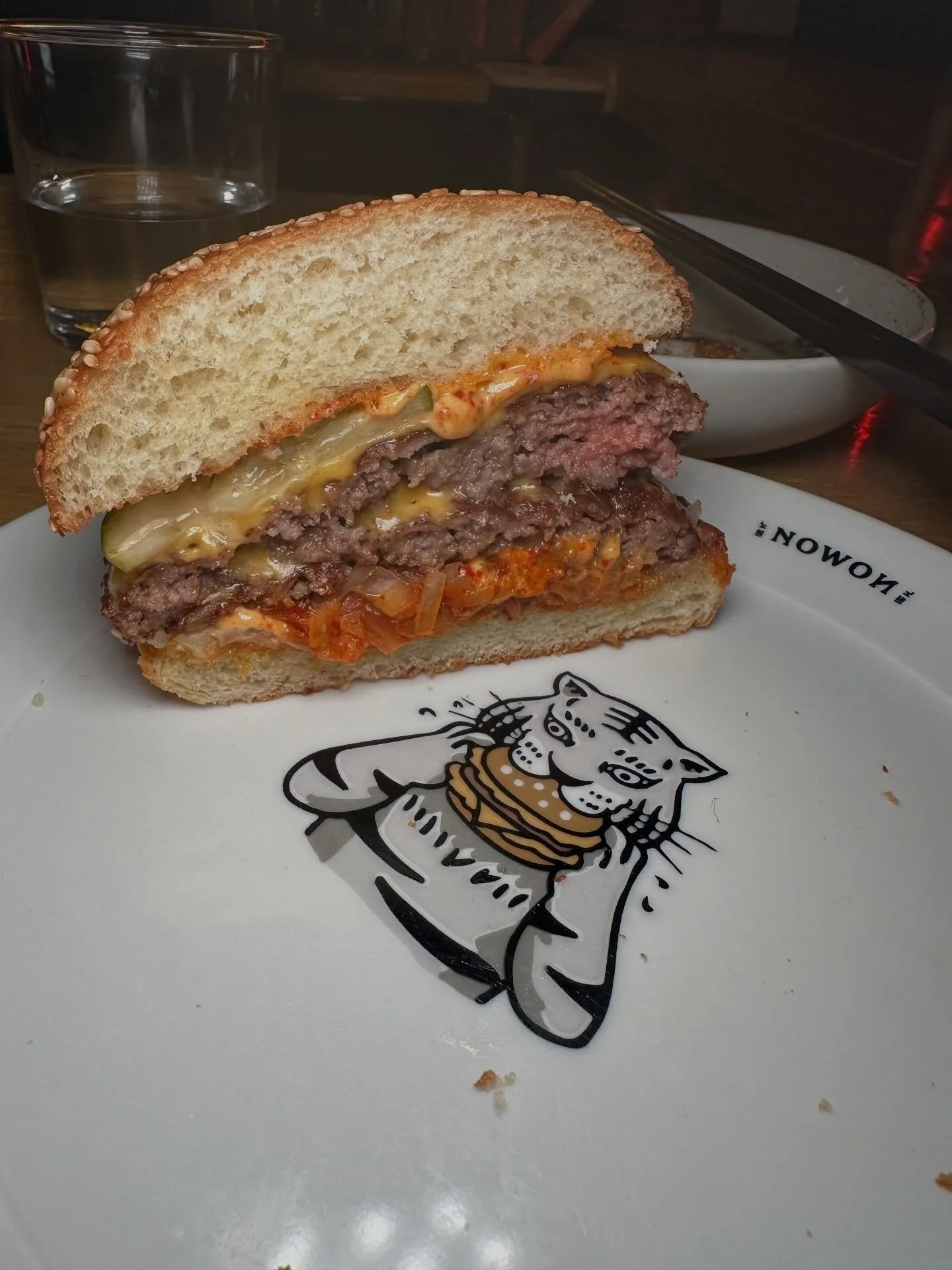 The @nowon.usa Legendary Cheeseburger. Smashed double, American cheese, kimchi special sauce, roasted kimchi, pickles, onion.

#mikeeatsnycburgers