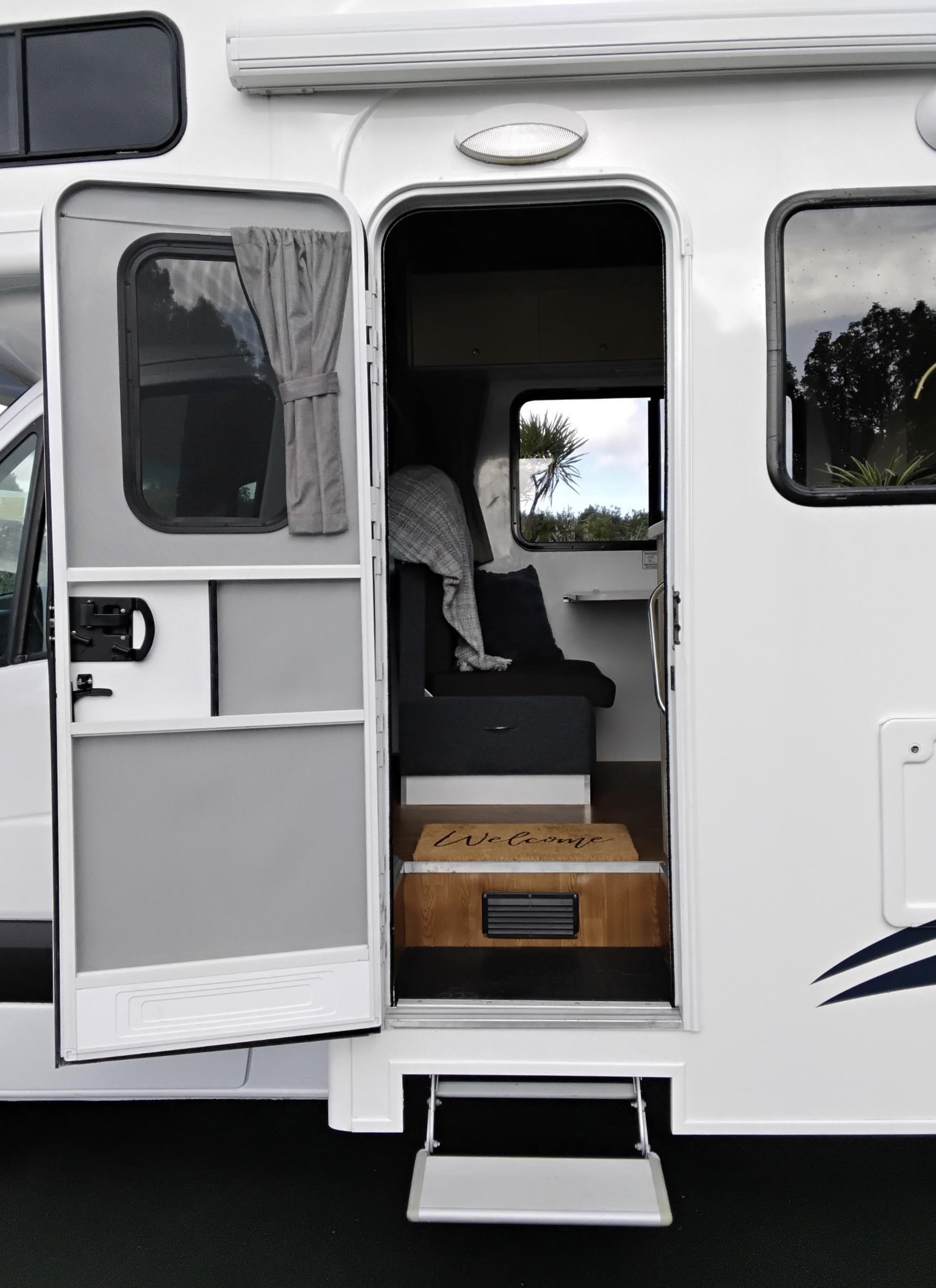 Entrance door and step of the Leo 6 berth motorhome with easy access into the living area
