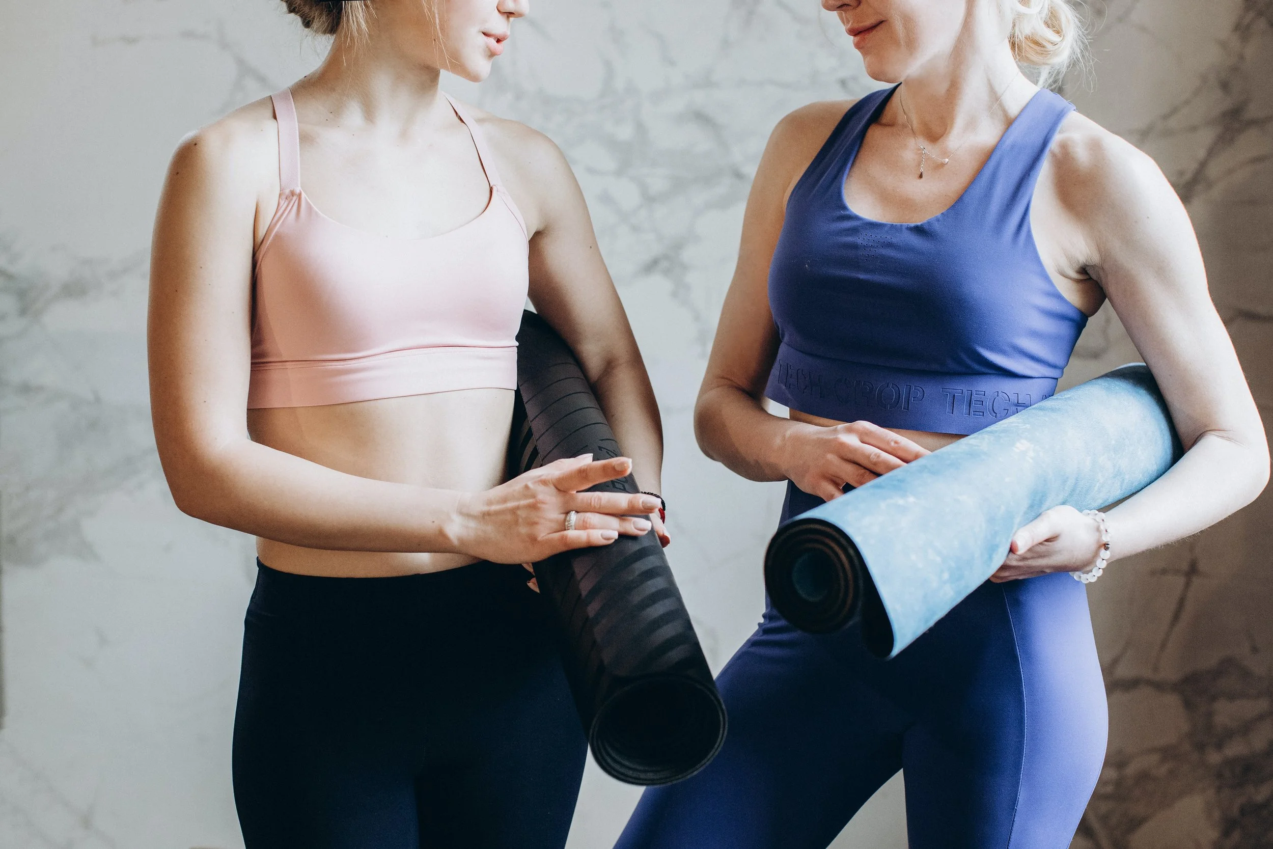 women with yoga mats