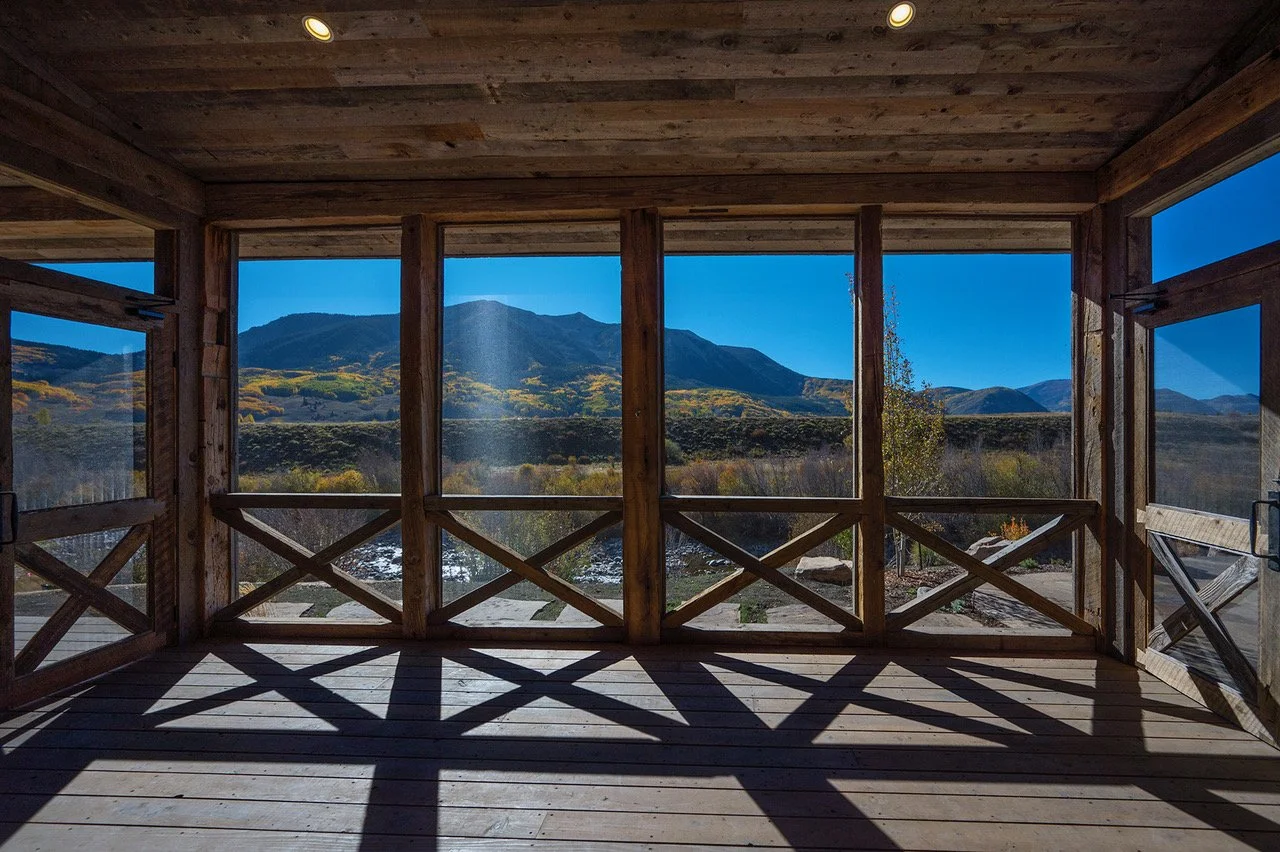 east-river-ranches-covered-porch-mountain-home-interior-desing-ansley-interiors.jpeg