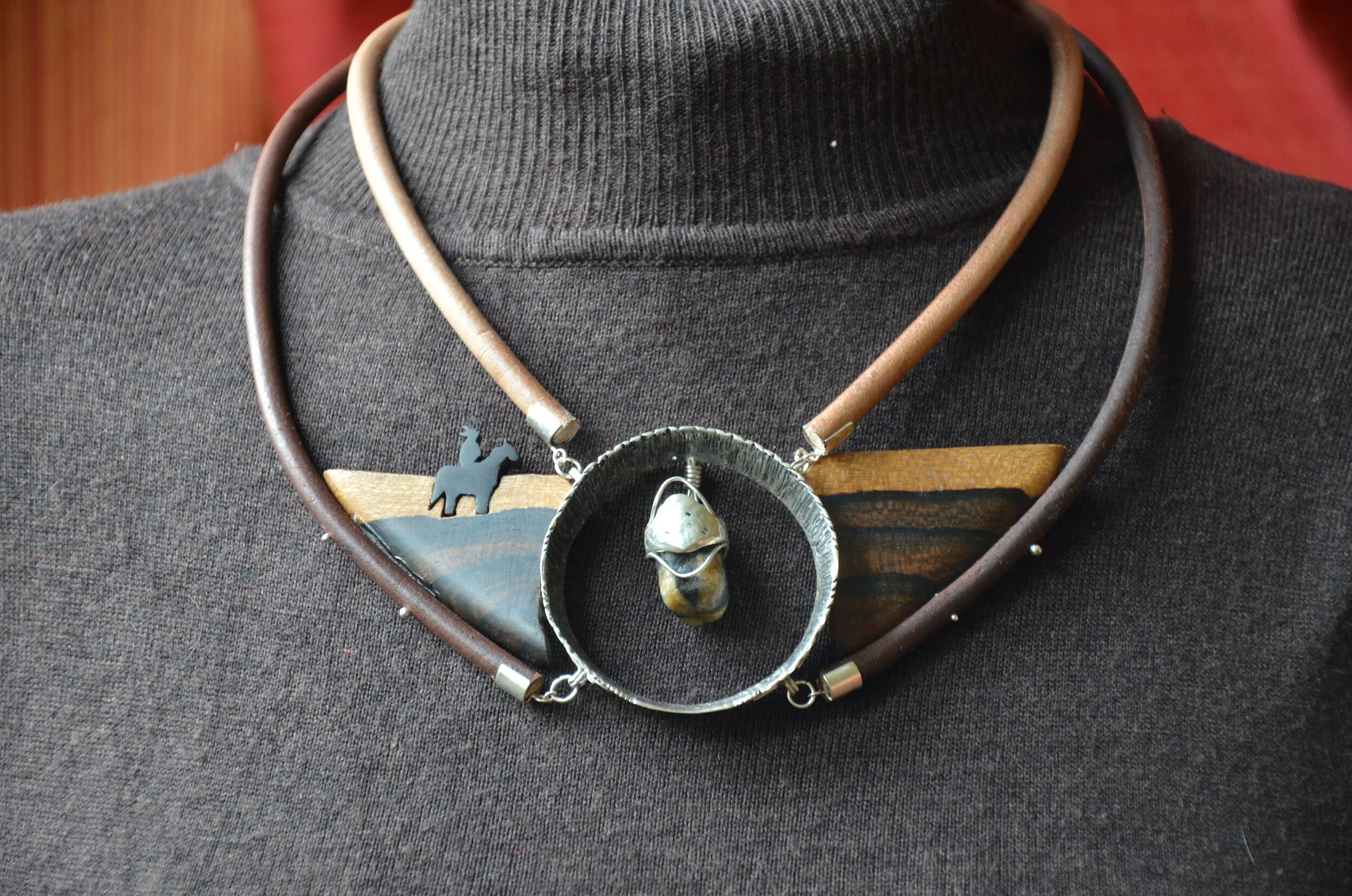 Indian necklace, made for Didier. A Chilean friend gave him this stone, a Chiastolite: legend says that if you find this stone in a river, it contains the soul of a Native American who died fighting against the conquistadors, thus inspiring design c…