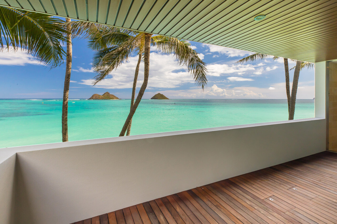  The master suites on the upper level have sliding glass walls that can  open to a large lanai to create a pavilion overlooking the ocean.  Hiep Nguyen/Slick Pixels Hawaii 