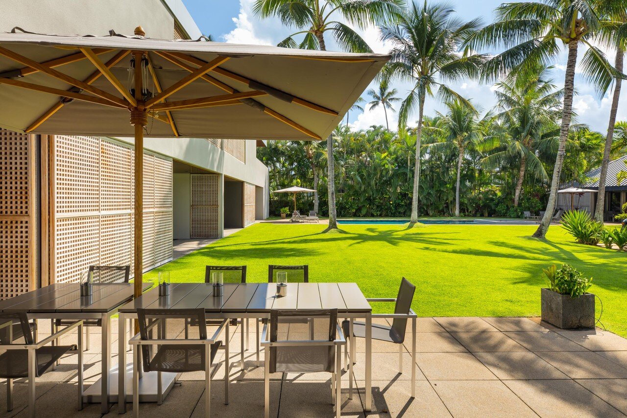  The outdoor tables, chairs, umbrellas, and loungers are from San Francisco-based furniture brand Henry Hall Designs.  Hiep Nguyen/Slick Pixels Hawaii 