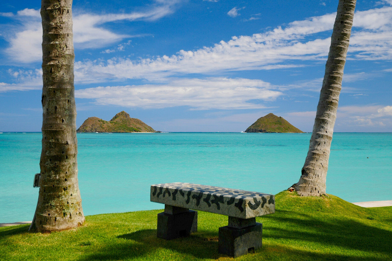  A carved granite bench provides the perfect perch overlooking the Mokulua Islands.  Hiep Nguyen/Slick Pixels Hawaii 