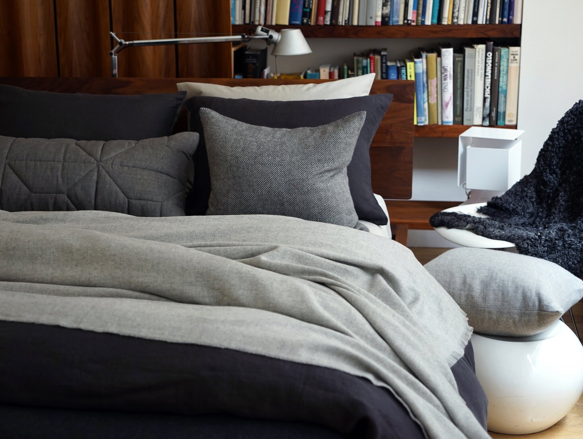  The way you dress your bed can change the feeling of a bedroom. Here, bedding and decorative pillows from Area, in shades of gray and various textures, create an inviting nest. Credit Courtesy of Area 