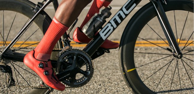Closeup of racing cyclist's feet on bicycle pedals