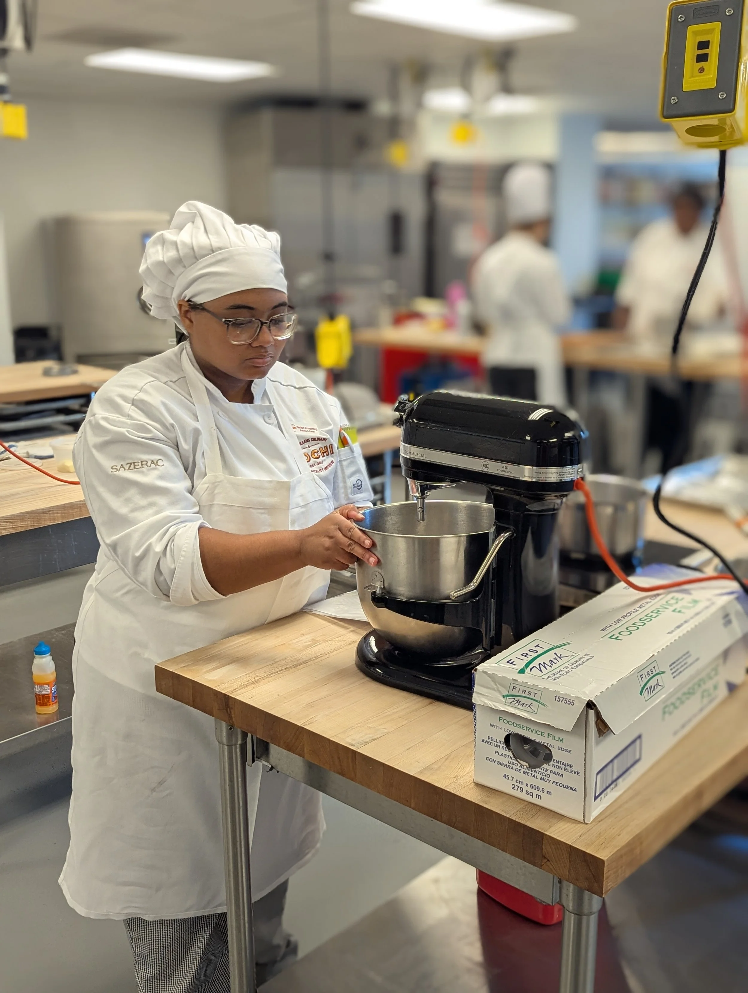 Taylor Armstrong using a KitchenAid mixer in a NOCHI baking kitchen
