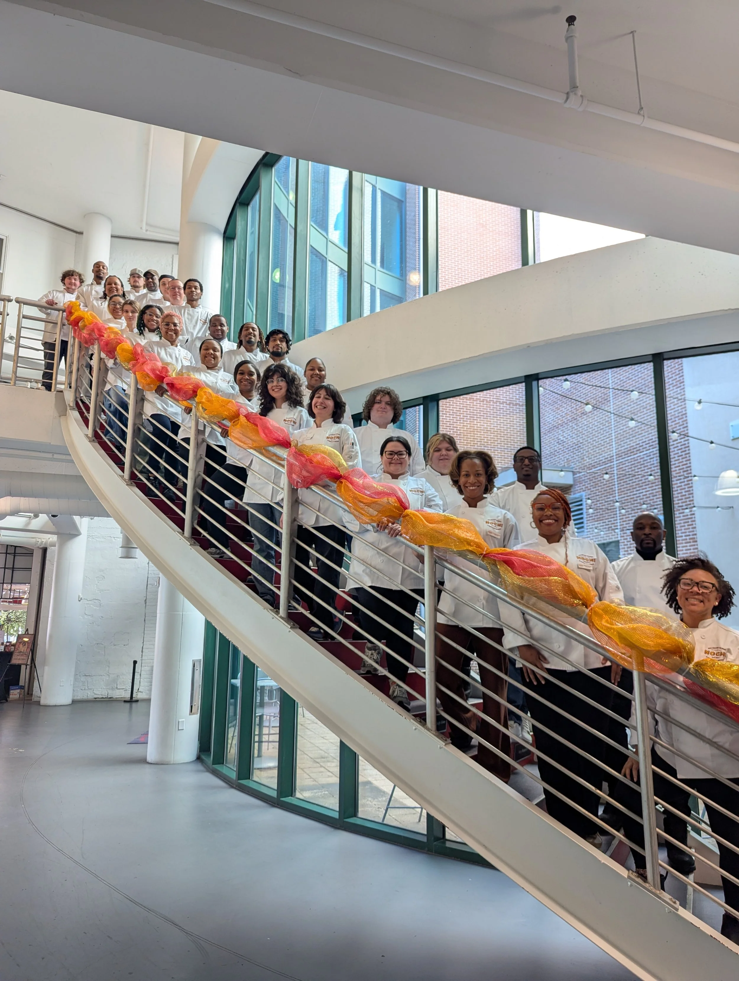 NOCHI students on a staircase at their orientation
