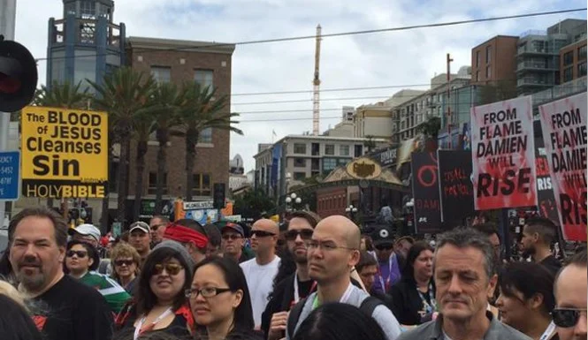 Christian-Protesters-Outside-San-Diego-Comic-Con-Joined-By-‘Damien’-Marketing-Picket-665x385.jpg