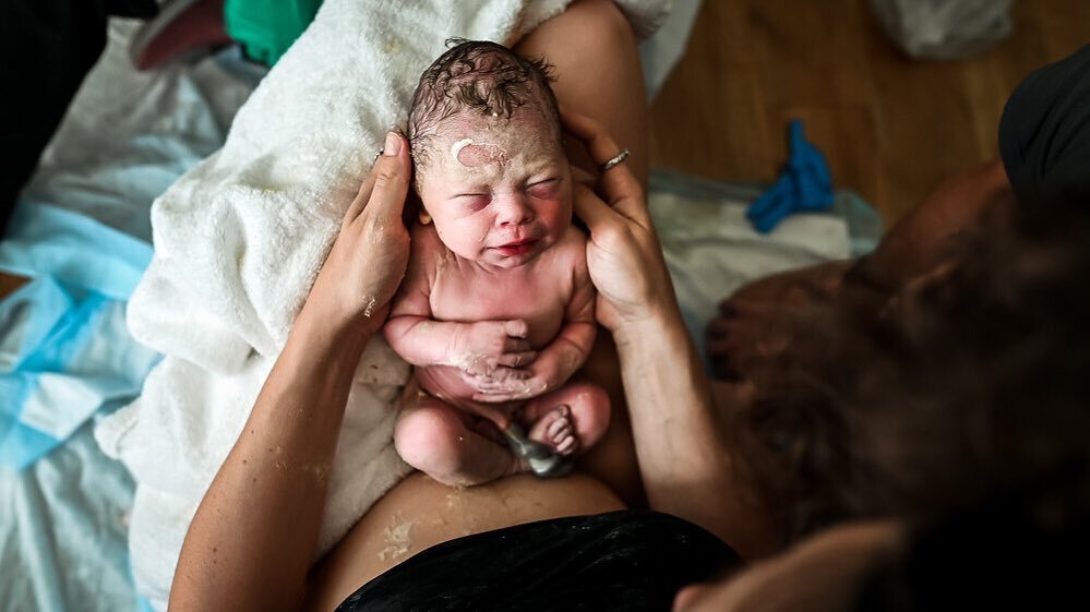 This photo is among one of my many favorites from 2021. Not just because it&rsquo;s a beautiful image, but because of the memories and emotions that it brings me back to when I see it. Watching this mom so determined to bring this babe into her arms 