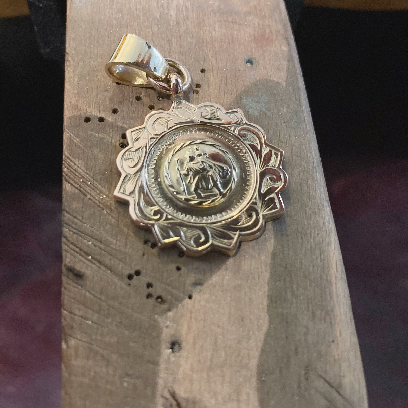 Re-model, adding a St.Christophers charm to the centre of this 9ct pendant and creating a 9ct gold bail loop.