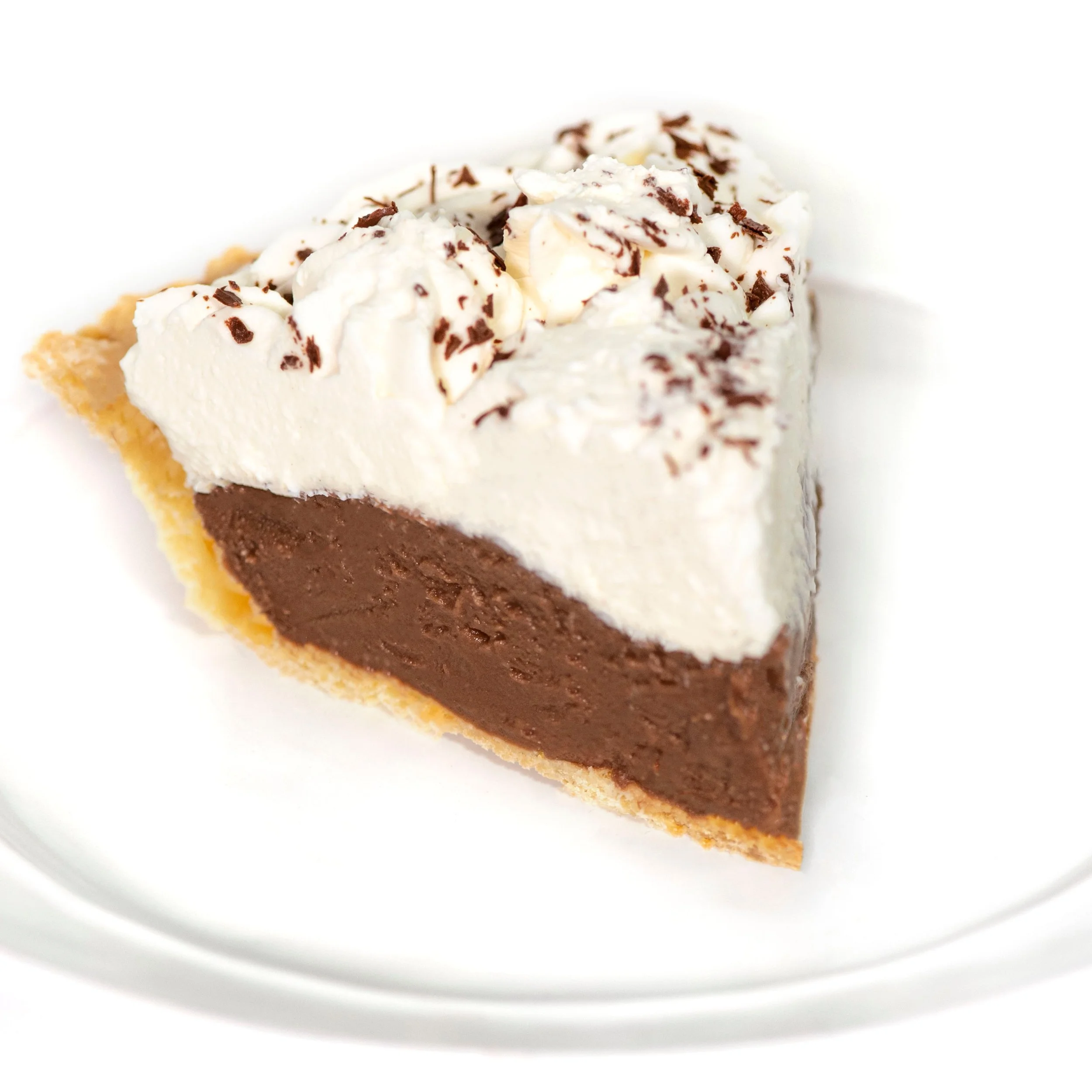 Slice of Chocolate Cream pie with chocolate shavings onto of Whipped Cream